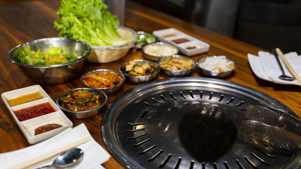 The BBQ grill along with some side dishes at GangNam Korean BBQ in Moore, Oklahoma.