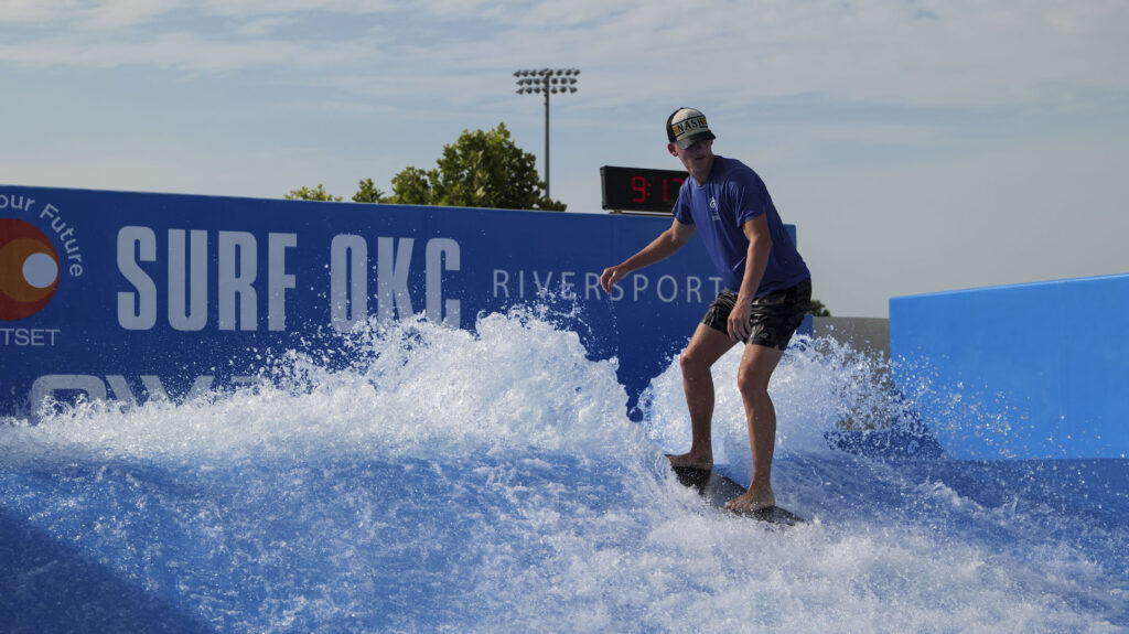 Photo by Dennis Spielman of a person surfing at Surf OKC. 