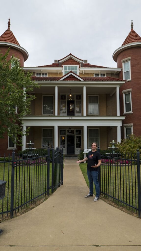 Photo of Jeff Provine standing outside The Belvedere Mansion.